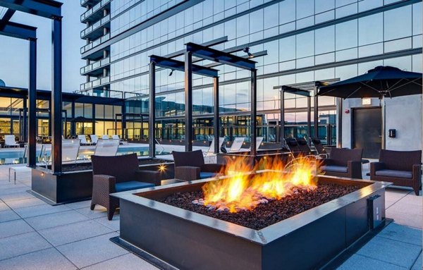 SoNo East Apartments: Cozy outdoor fire pit area with seating, perfect for relaxation in luxury Chicago apartments