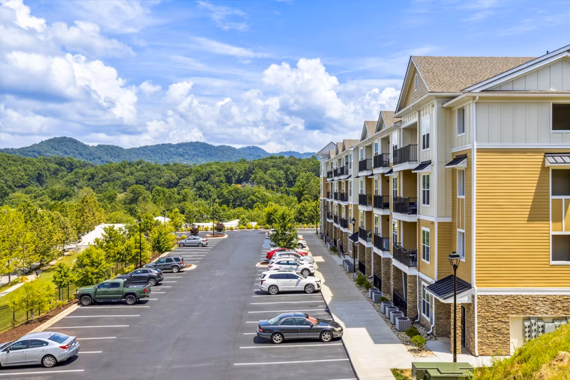Verde Vista Apartments: Elegant view of luxury high-rise nestled in lush greenery