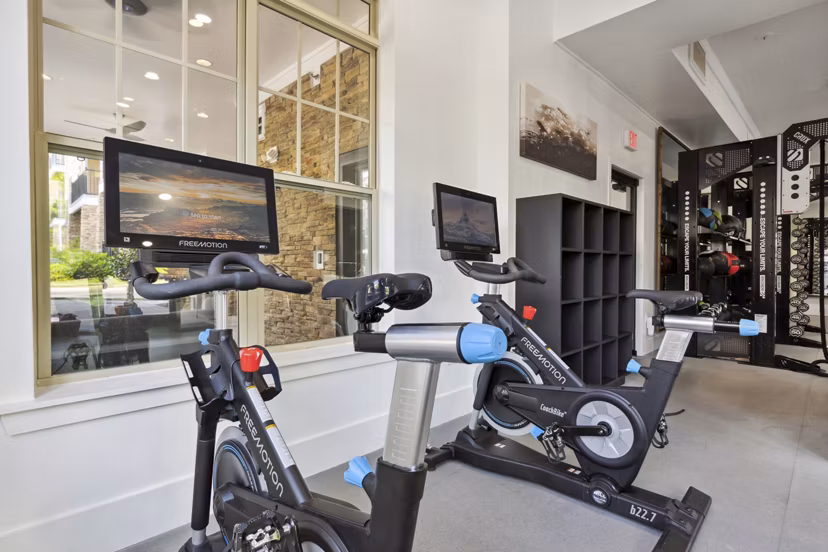 State-of-the-art fitness center with modern equipment at Verde Vista Apartments, offering luxury workout spaces for residents