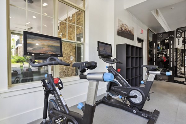 State-of-the-art fitness center with modern equipment at Verde Vista Apartments, offering luxury workout spaces for residents
