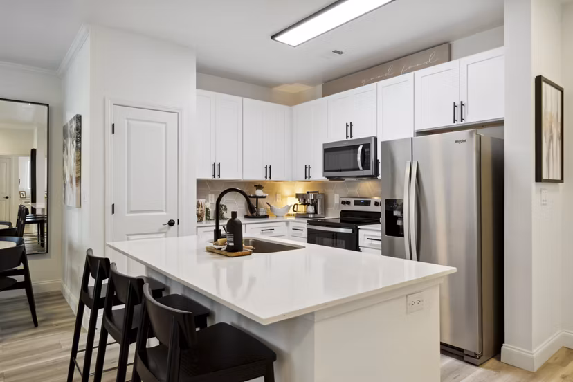 Kitchens showcasing modern appliances and granite countertops at Verde Vista Apartments