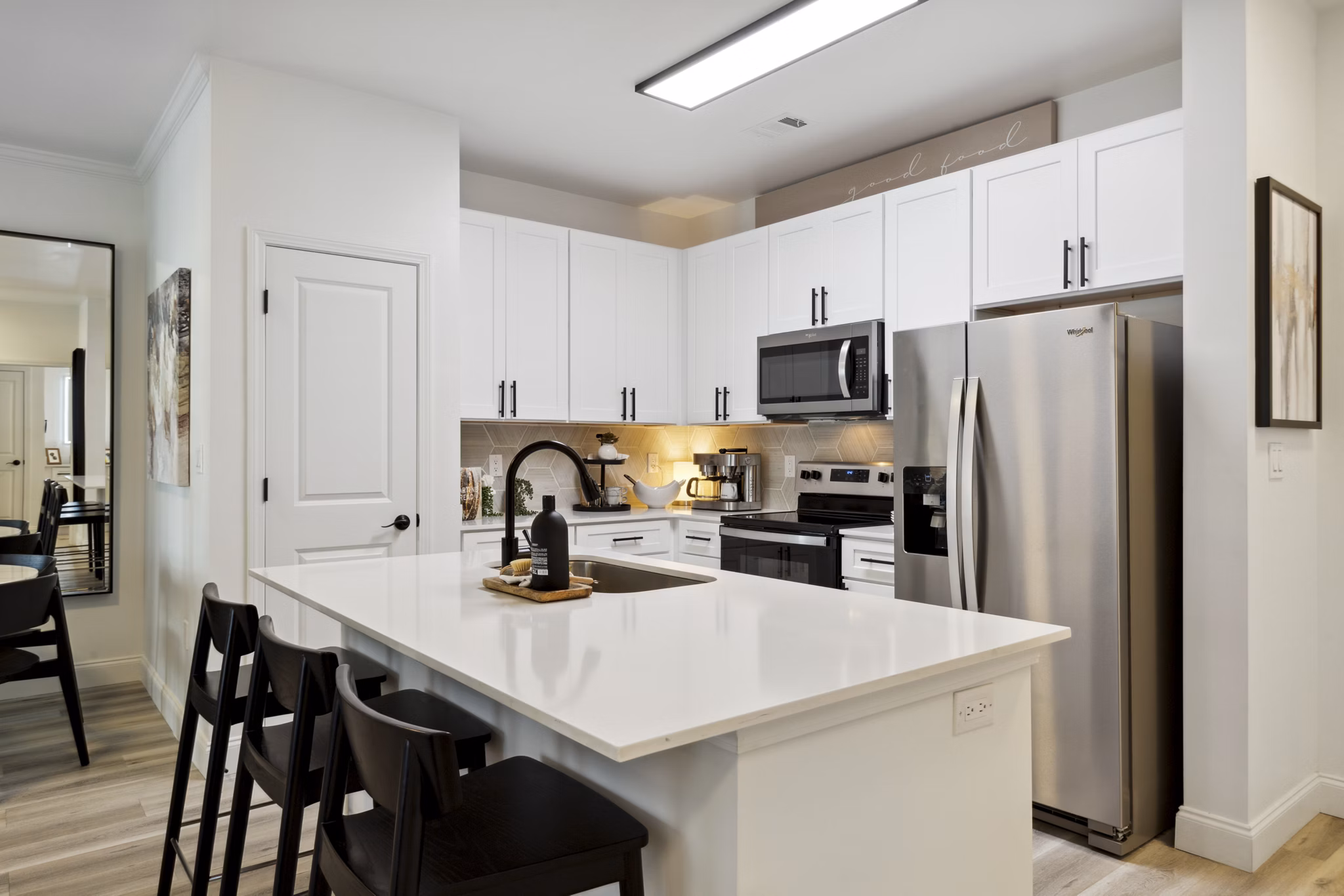 Kitchens showcasing modern appliances and granite countertops at Verde Vista Apartments