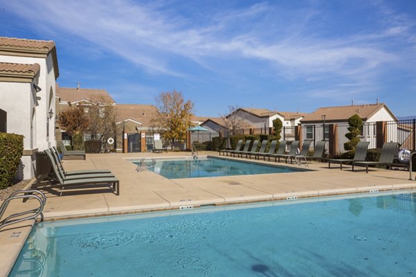 Inviting outdoor pool with sun loungers at Diamond Mesa Apartments