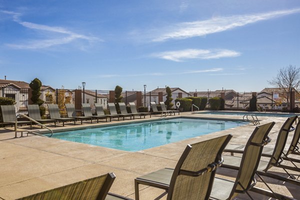 Resort-style pool at Diamond Mesa Apartments with lounge areas