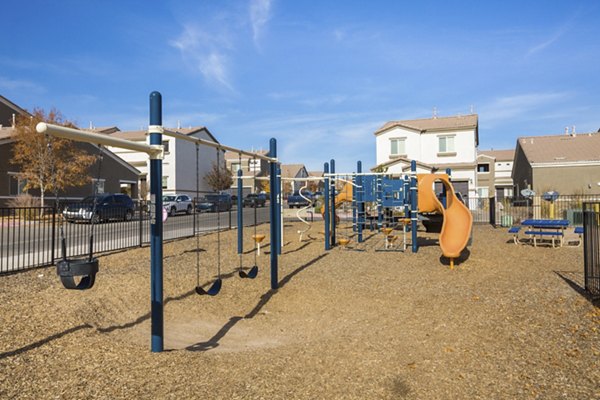 Playground with modern equipment at Diamond Mesa Apartments in a family-friendly setting