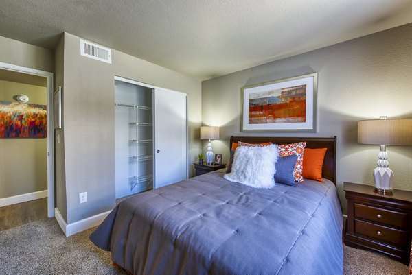 Cozy bedroom with modern decor at Allure at Tempe Apartments