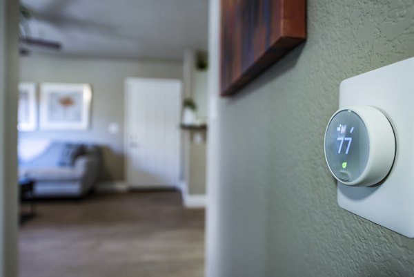 Hallway thermostat at Allure at Tempe Apartments: Modern design in a luxury apartment setting