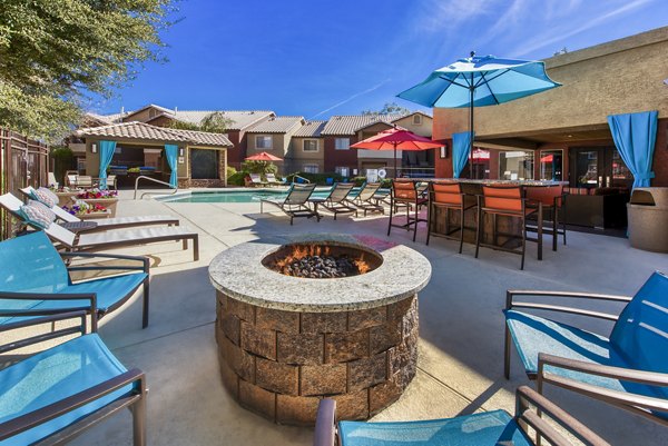 Fire pit with cozy seating at Allure at Tempe Apartments, an inviting outdoor lounge space perfect for relaxation and gatherings