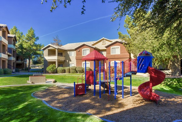 Colorful playground with slides and swings at Allure at Tempe Apartments, a luxury living community in Arizona
