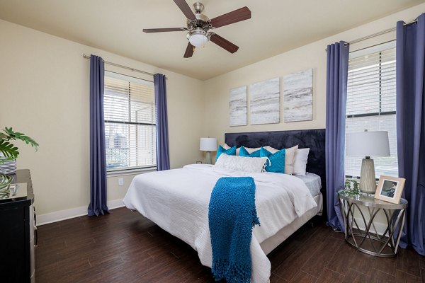 Cozy bedroom with modern design at Ladera Apartments