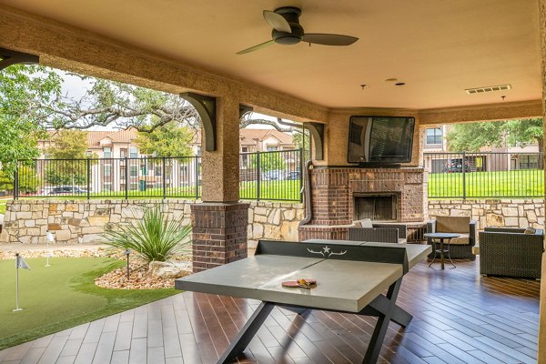 Vibrant game room with pool table and lounge seating at Ladera Apartments, a luxury living community