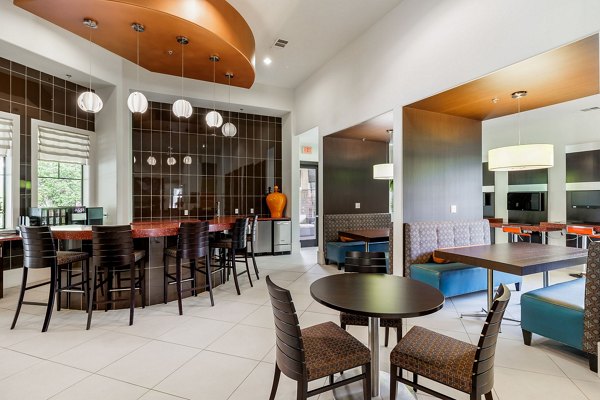 Dining room with modern decor at Ladera Apartments featuring elegant lighting and stylish furnishings, ideal for luxury living experiences