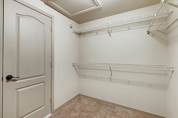 Walk-in closet with ample storage in Barton Creek Villas Apartments, a Greystar luxury property