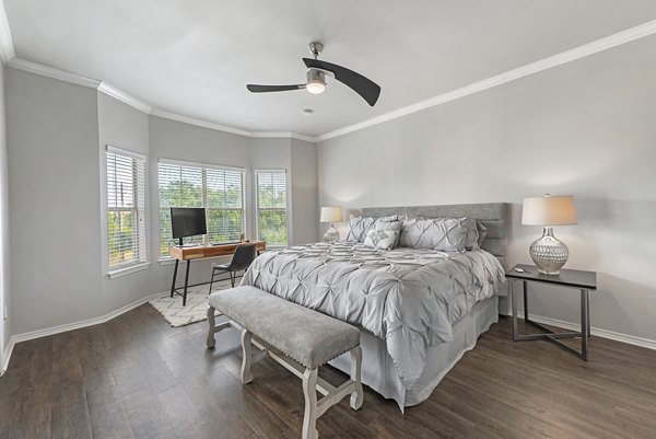 Barton Creek Villas: Elegant bedroom with plush bedding and natural light in luxury apartments