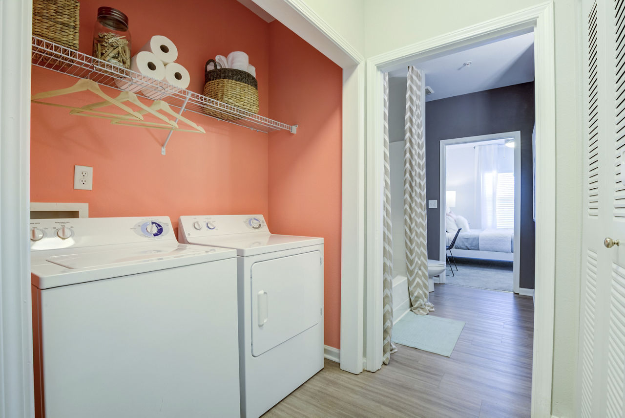 Laundry room at The Vinoy At Innovation Park Apartments