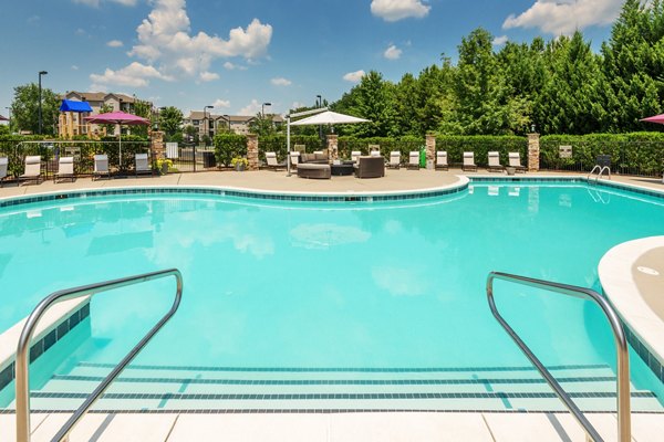 Inviting pool area with comfortable lounge chairs at The Vinoy at Innovation Park Apartments