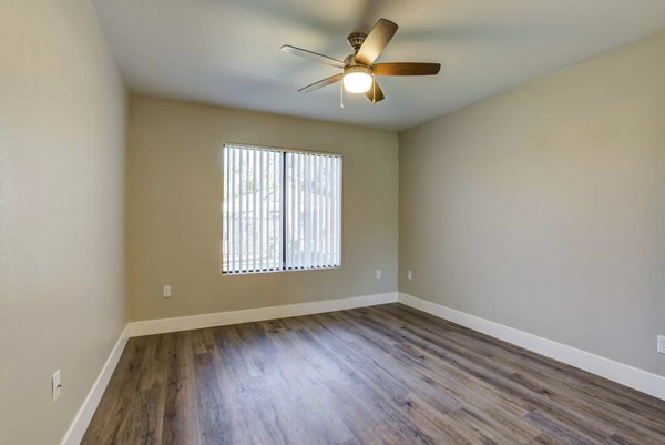 Avana Desert View Apartments: Modern bedroom with minimalist decor and ample natural light in luxury apartment community