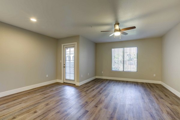 Spacious living room with modern decor at Avana Desert View Apartments, luxury residence from Greystar