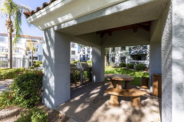 Outdoor grill area with modern seating at Avana Desert View Apartments
