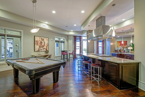 Clubhouse featuring modern design and comfortable seating at Whitehall Parc Apartment Homes, a luxury community by Greystar