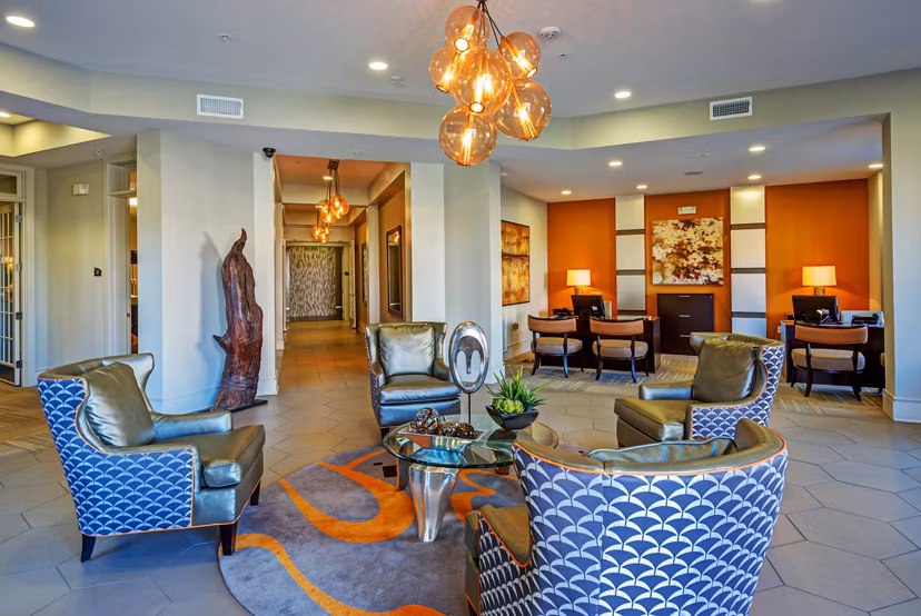 Clubhouse with modern seating and decor at Whitehall Parc Apartment Homes