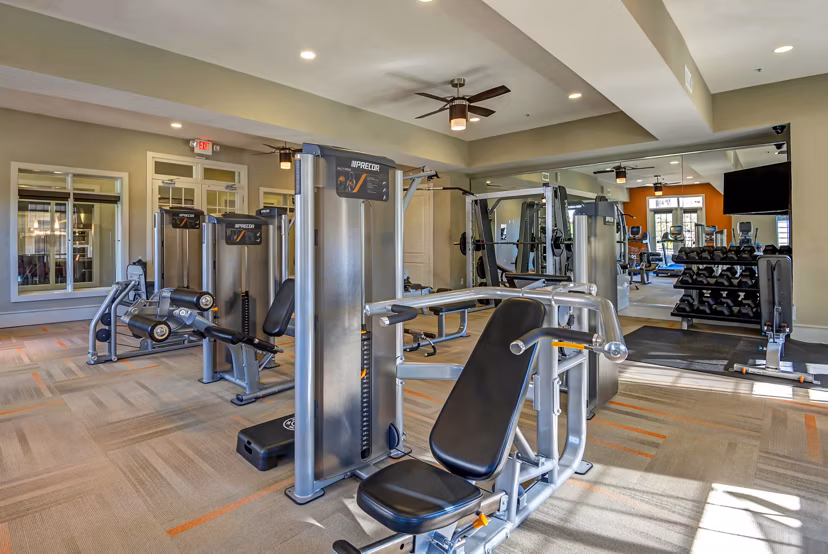 State-of-the-art fitness center with modern equipment at Whitehall Parc Apartment Homes, offering residents a complete workout experience