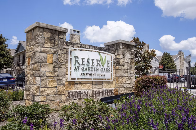 Reserve at Garden Oaks: Contemporary luxury apartments with green landscaping in urban neighborhood