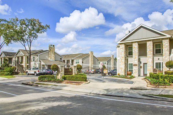 Reserve at Garden Oaks: Contemporary luxury apartments with green landscaping in urban neighborhood