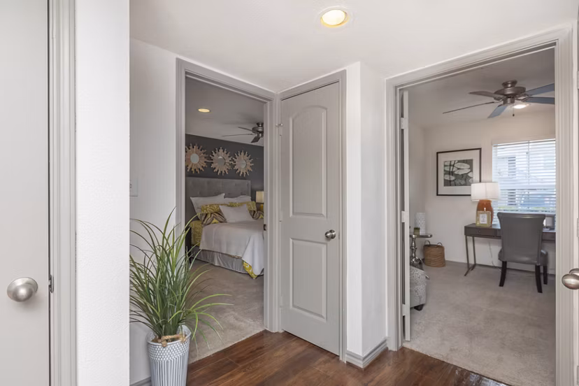 Spacious bedroom with modern decor at Reserve at Garden Oaks Apartments featuring ample natural light Ideal for comfortable living