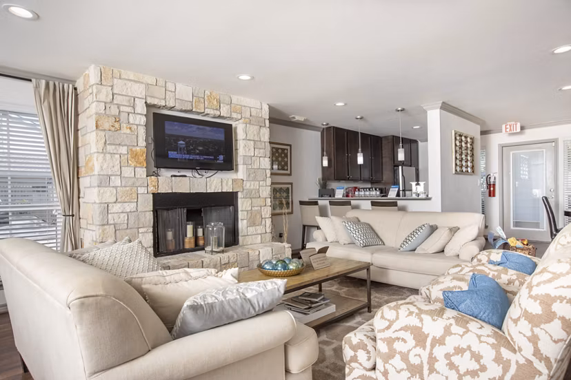 Clubhouse with modern design and comfortable seating at Reserve at Garden Oaks apartments