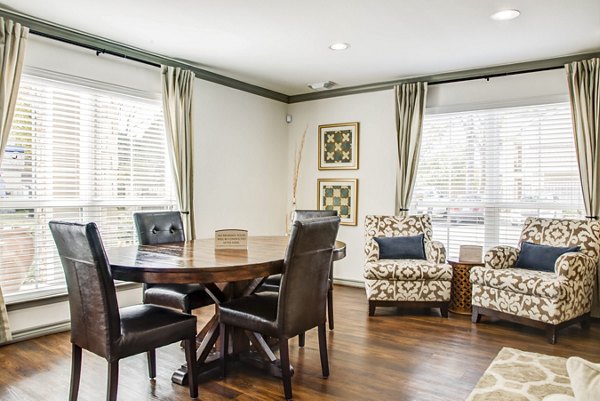 Clubhouse featuring modern design and spacious seating at Reserve at Garden Oaks Apartments, offering luxury amenities for residents