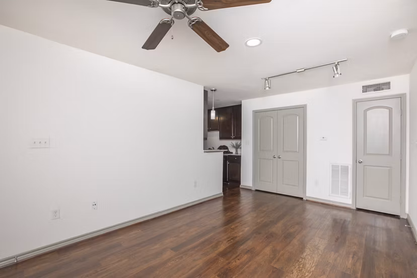 Spacious living room with modern furnishings in Reserve at Garden Oaks Apartments