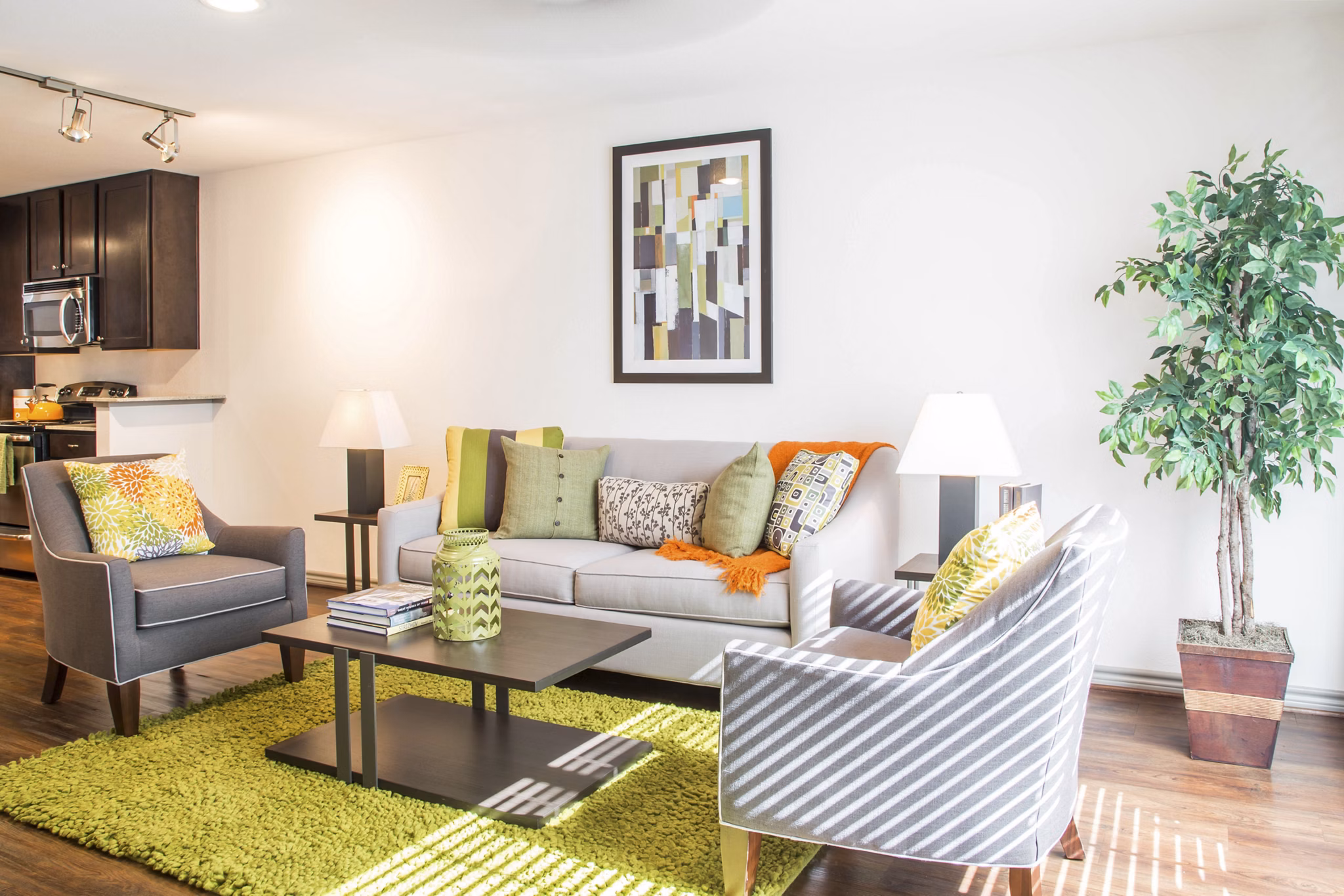 Spacious living room with modern furnishings in Reserve at Garden Oaks Apartments