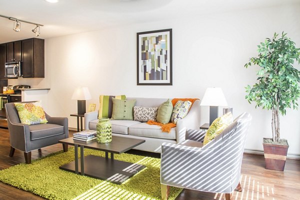 Spacious living room with modern furnishings in Reserve at Garden Oaks Apartments