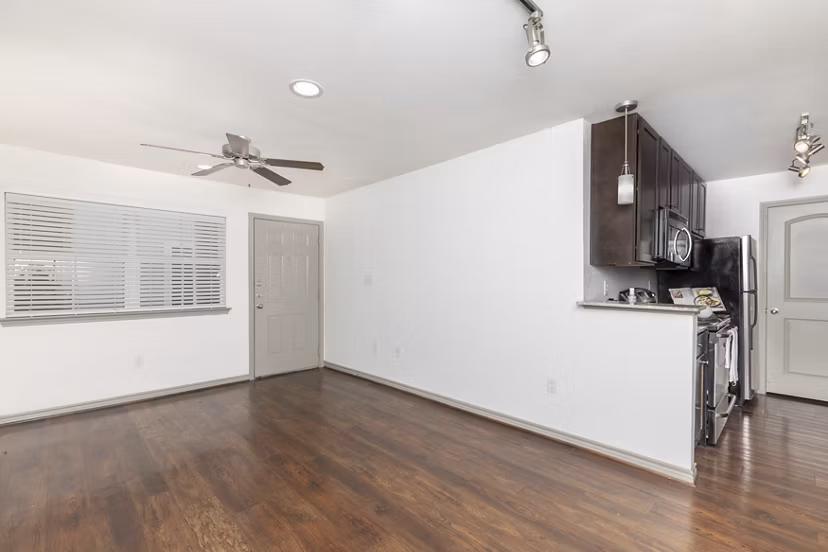 Living room featuring stylish decor and ample natural light in Reserve at Garden Oaks Apartments