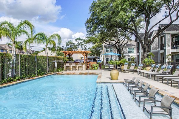 Resort-style pool with sundeck at Reserve at Garden Oaks Apartments, luxury living in a serene setting