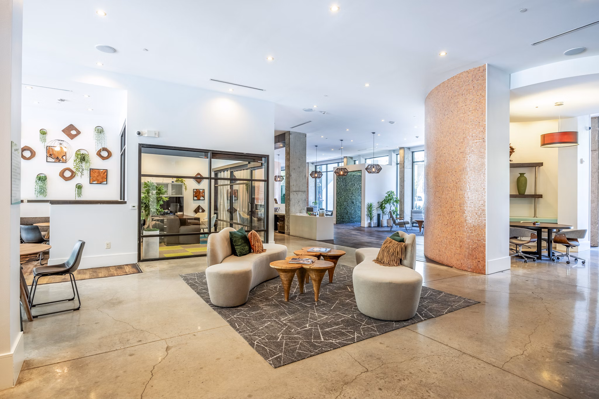 Clubhouse with modern design and communal seating at Tree Apartments