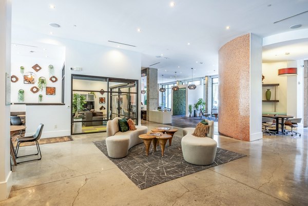 Clubhouse with modern design and communal seating at Tree Apartments