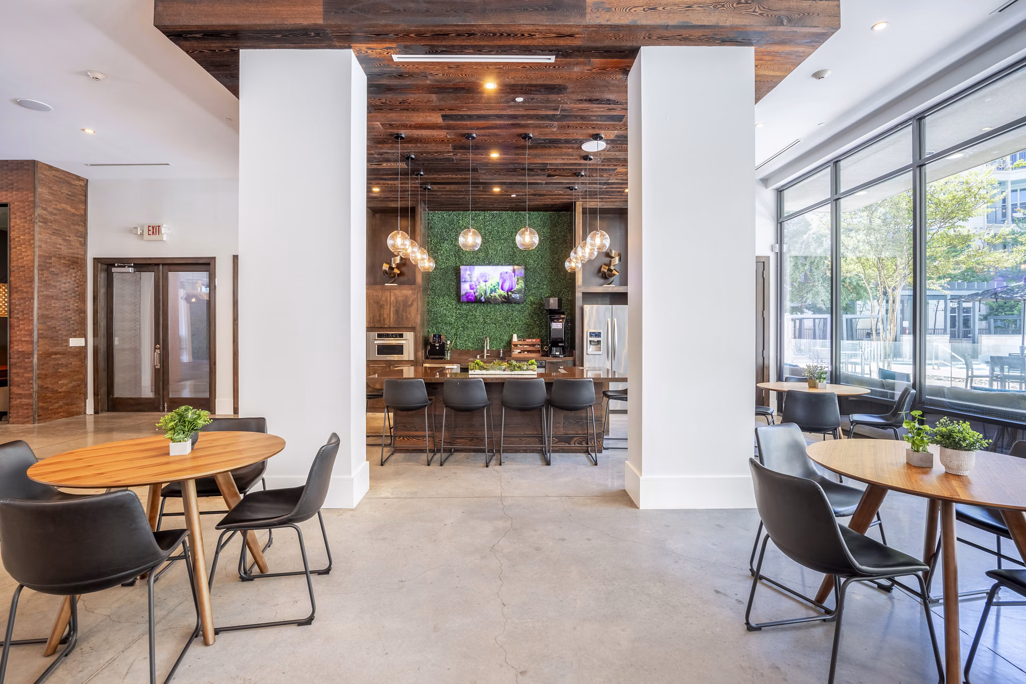 Clubhouse with modern amenities at Tree Apartments featuring luxury seating and design, perfect for community events and gatherings