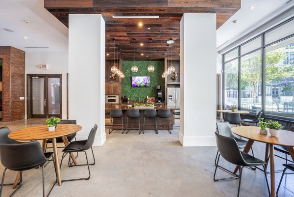 Clubhouse with modern amenities at Tree Apartments featuring luxury seating and design, perfect for community events and gatherings