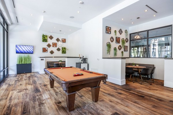 clubhouse game room at Tree Apartments