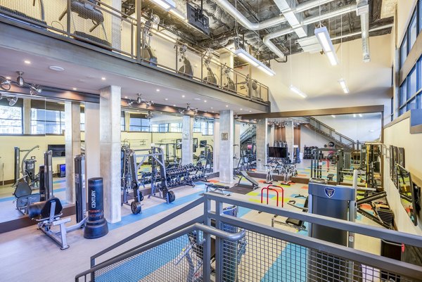 State-of-the-art fitness center with modern equipment at Tree Apartments, offering premium workout spaces for residents