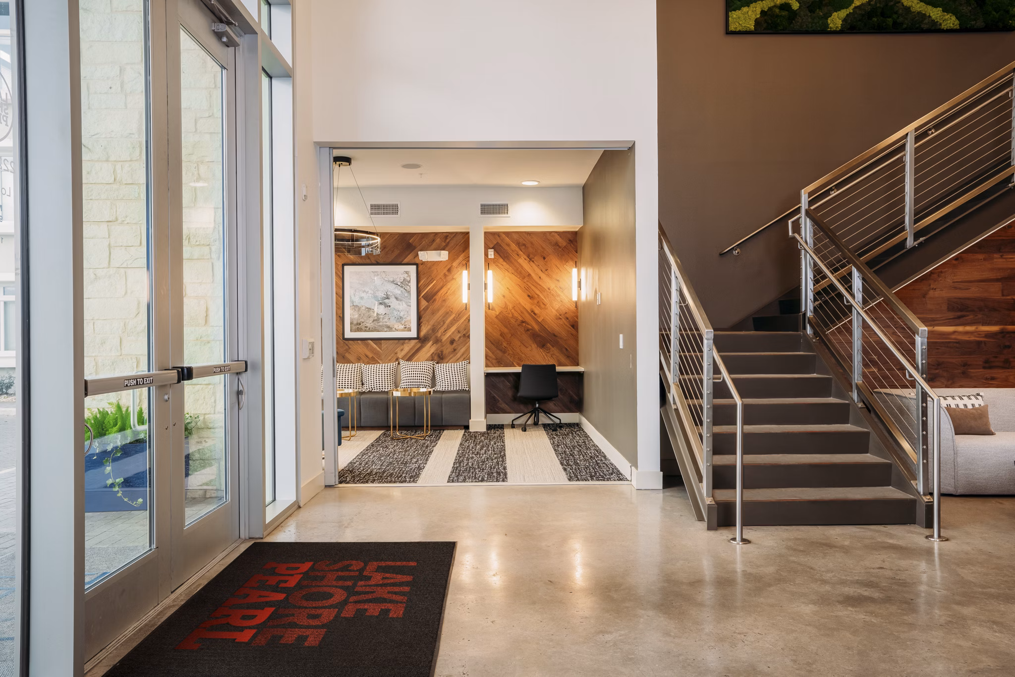 Clubhouse with modern design and ample seating at Lakeshore Pearl Apartments, offering luxury amenities and vibrant community spaces