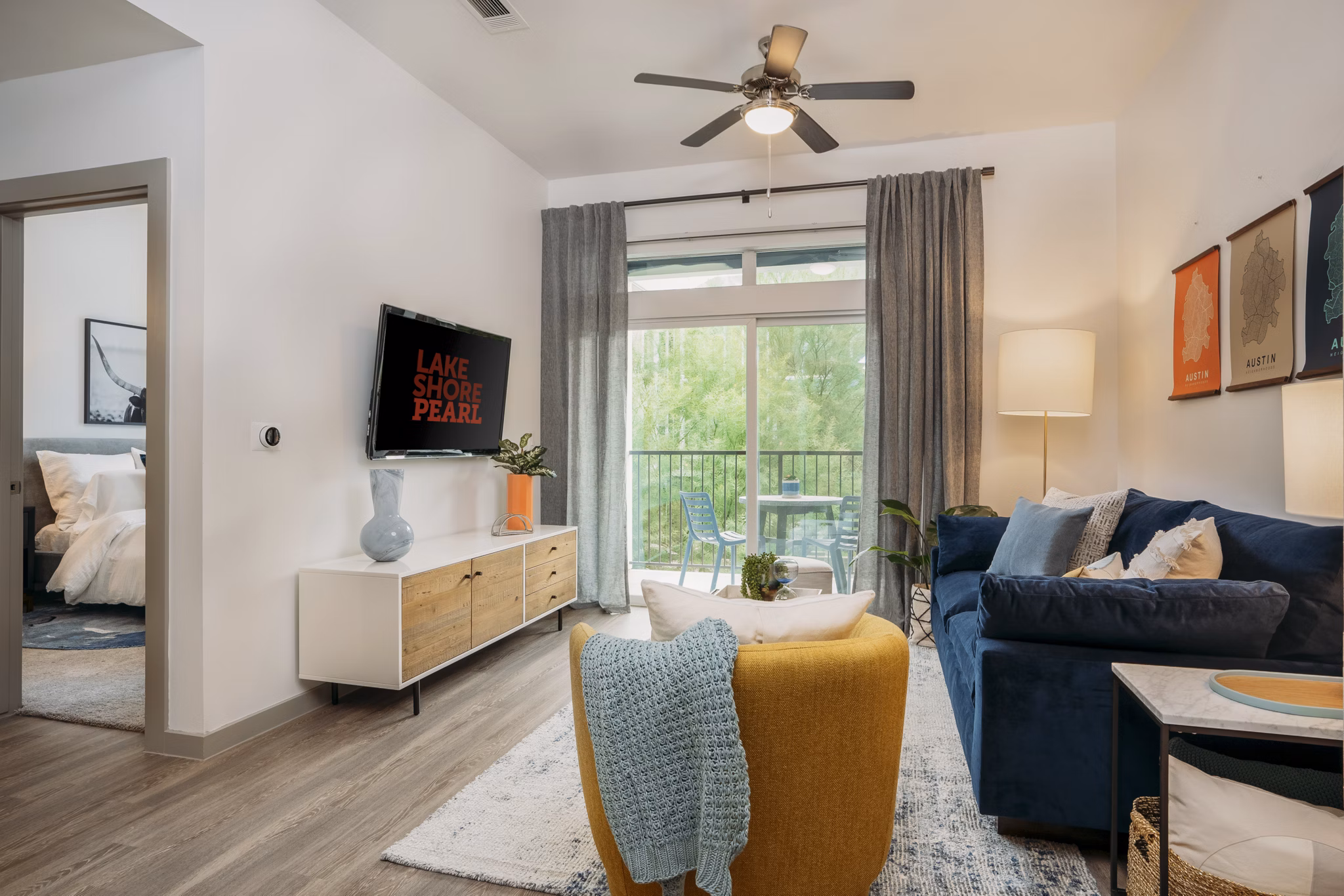 Modern living room with stylish decor and ample natural light at Lakeshore Pearl Apartments