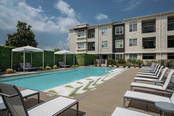Luxurious poolside retreat at Lakeshore Pearl Apartments in Austin, TX with elegant seating and serene surroundings for ultimate relaxation