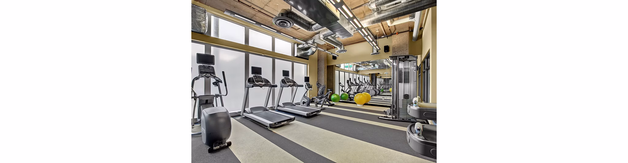 State-of-the-art fitness center with modern equipment at 708 Uptown Apartments for luxury living