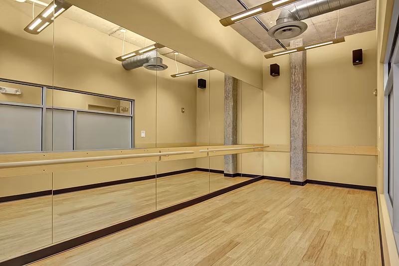 Yoga/spin studio with modern equipment at 708 Uptown Apartments, offering a dynamic fitness experience for residents