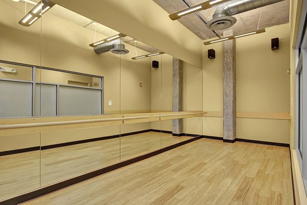 Yoga/spin studio with modern equipment at 708 Uptown Apartments, offering a dynamic fitness experience for residents