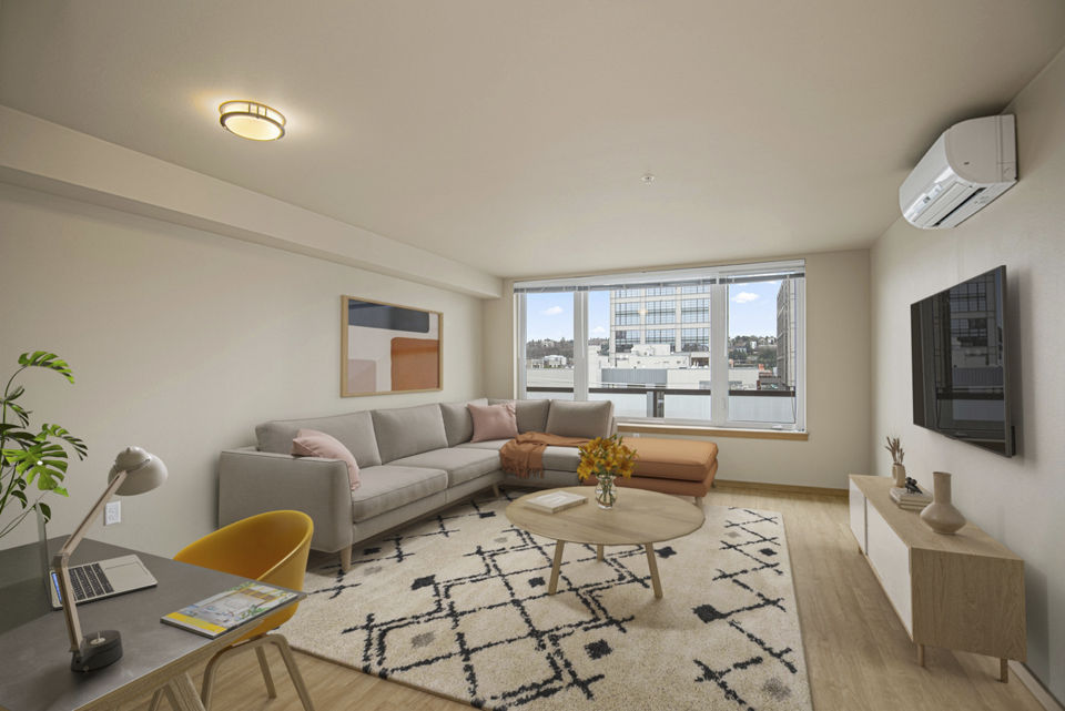 Spacious living room with modular furniture in 708 Uptown Apartments