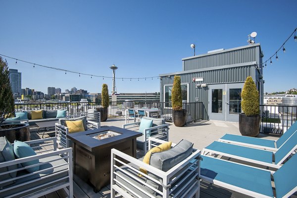 Outdoor patio with modern seating at 708 Uptown Apartments, ideal for social gatherings and relaxation